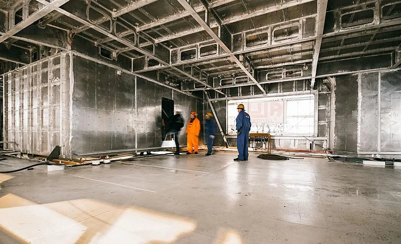 a group of people in a warehouse aboard BLACK SHARK Yacht for Sale