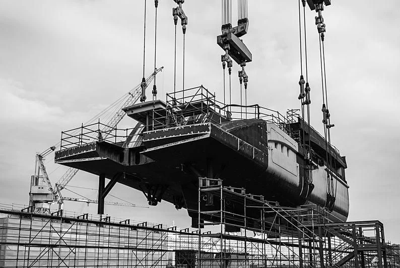 a large ship in a dock aboard BLACK SHARK Yacht for Sale