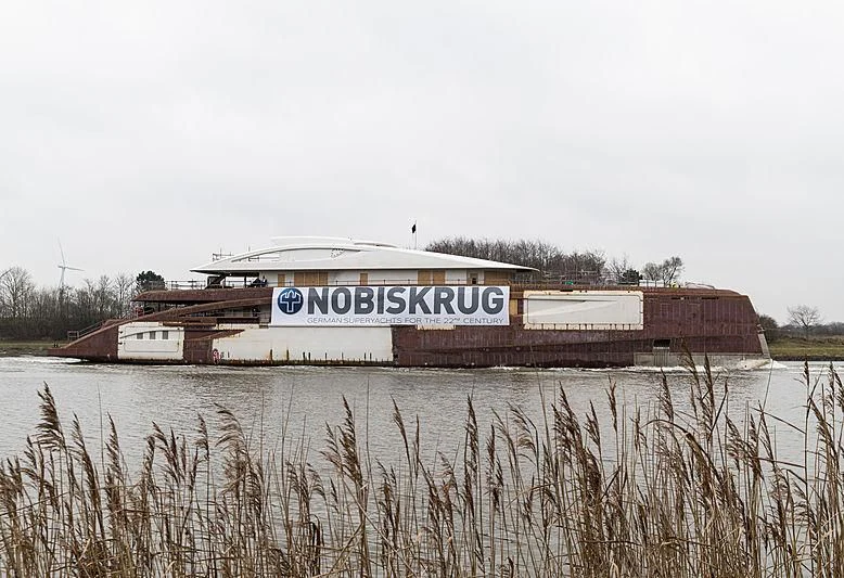 a building with a sign on the roof aboard BLACK SHARK Yacht for Sale