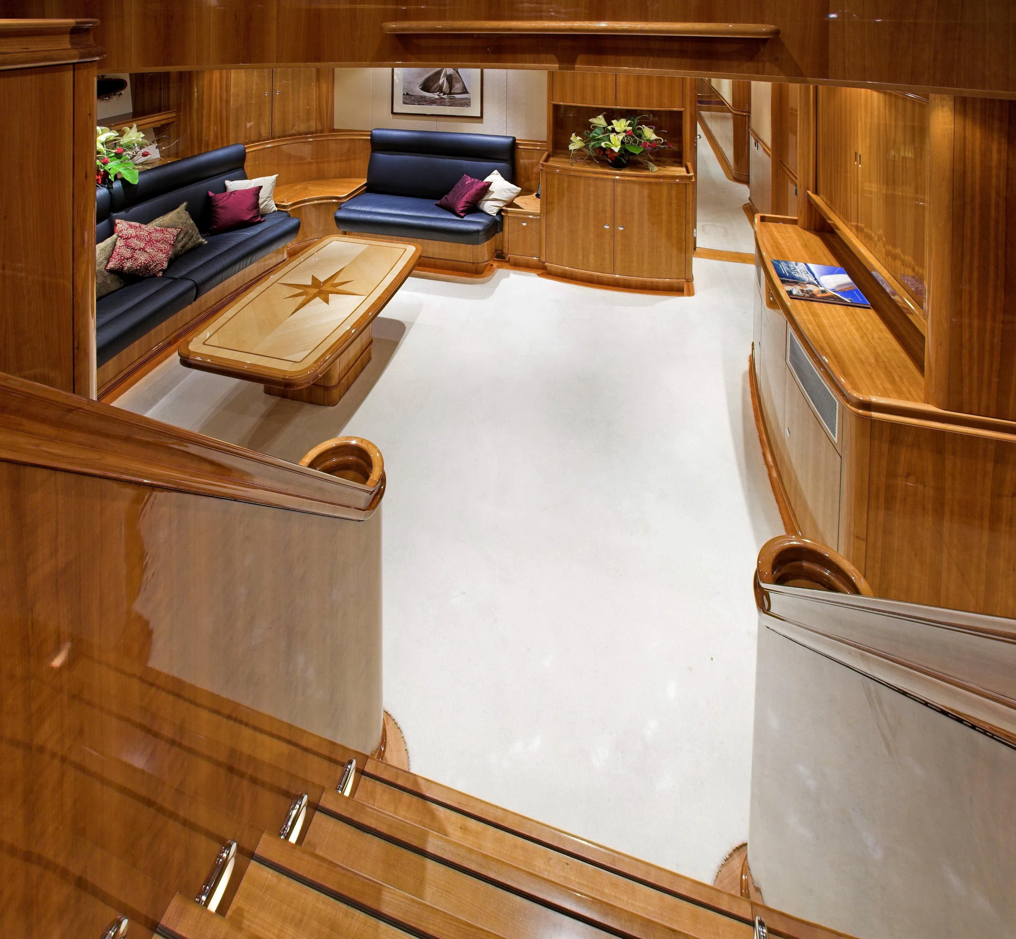 a room with a couch and a table aboard SEABISCUIT Yacht for Sale