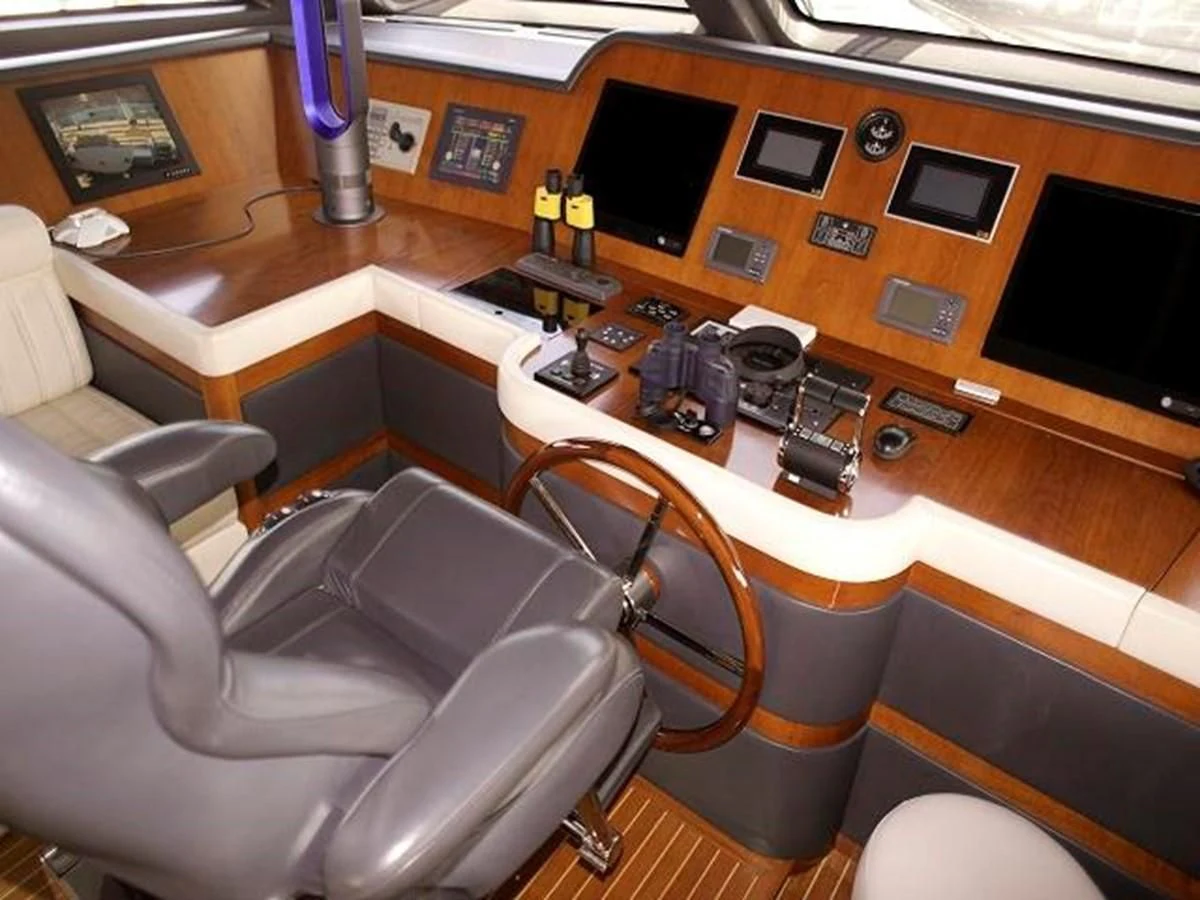 a room with a desk and chairs aboard BENETTI TRADITION 100 Yacht for Sale