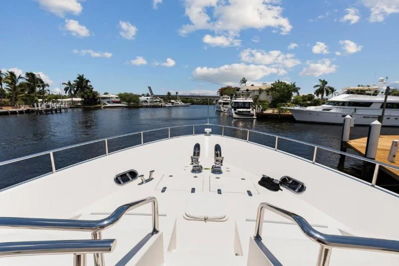 a large white boat with a dock and boats on it aboard MENTORSHIP IV Yacht for Sale