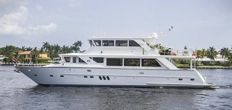 a white yacht on the water aboard MENTORSHIP IV Yacht for Sale