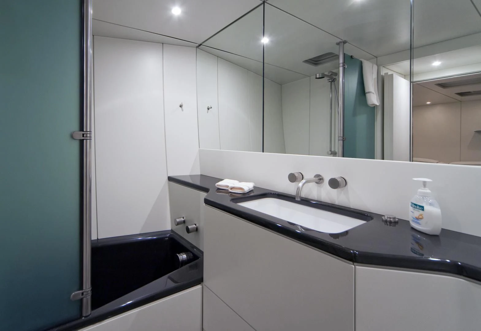 a bathroom with a large mirror aboard RUNNING ON FAITH Yacht for Sale