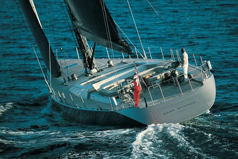 a person standing on a boat aboard RUNNING ON FAITH Yacht for Sale