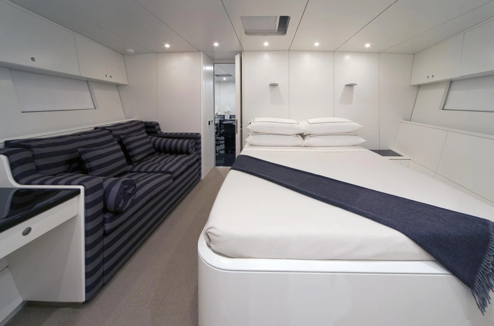 a room with a bed and a desk aboard RUNNING ON FAITH Yacht for Sale