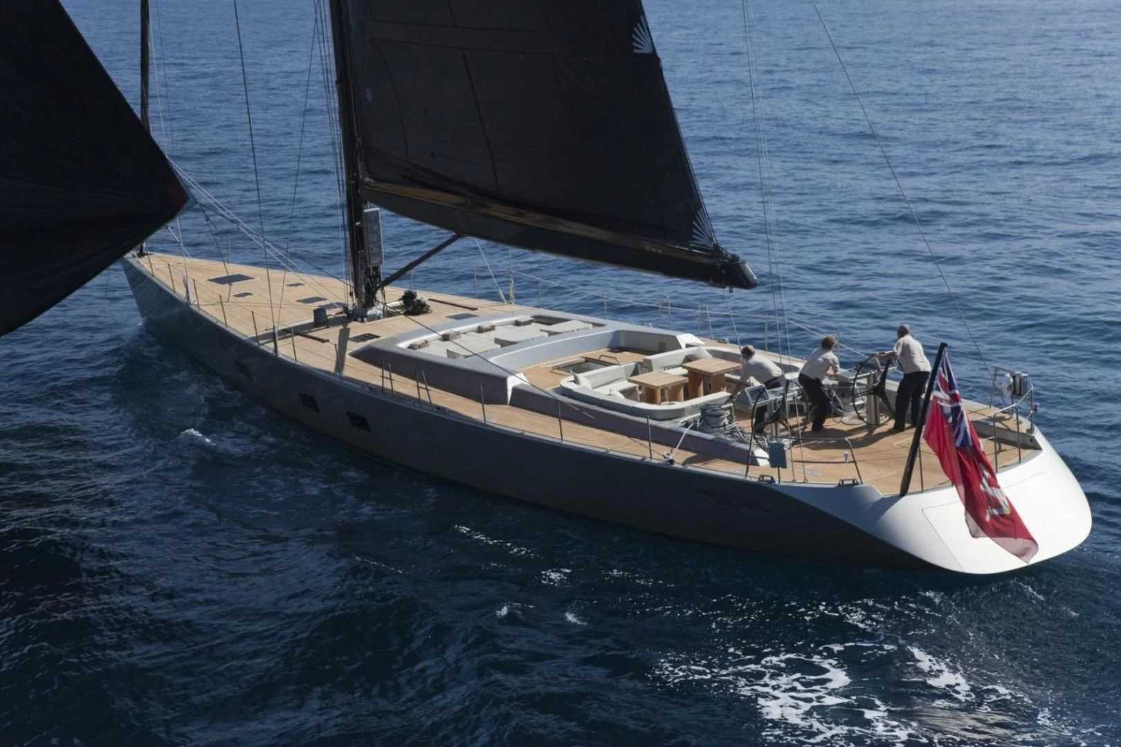 a boat with people on it aboard RUNNING ON FAITH Yacht for Sale