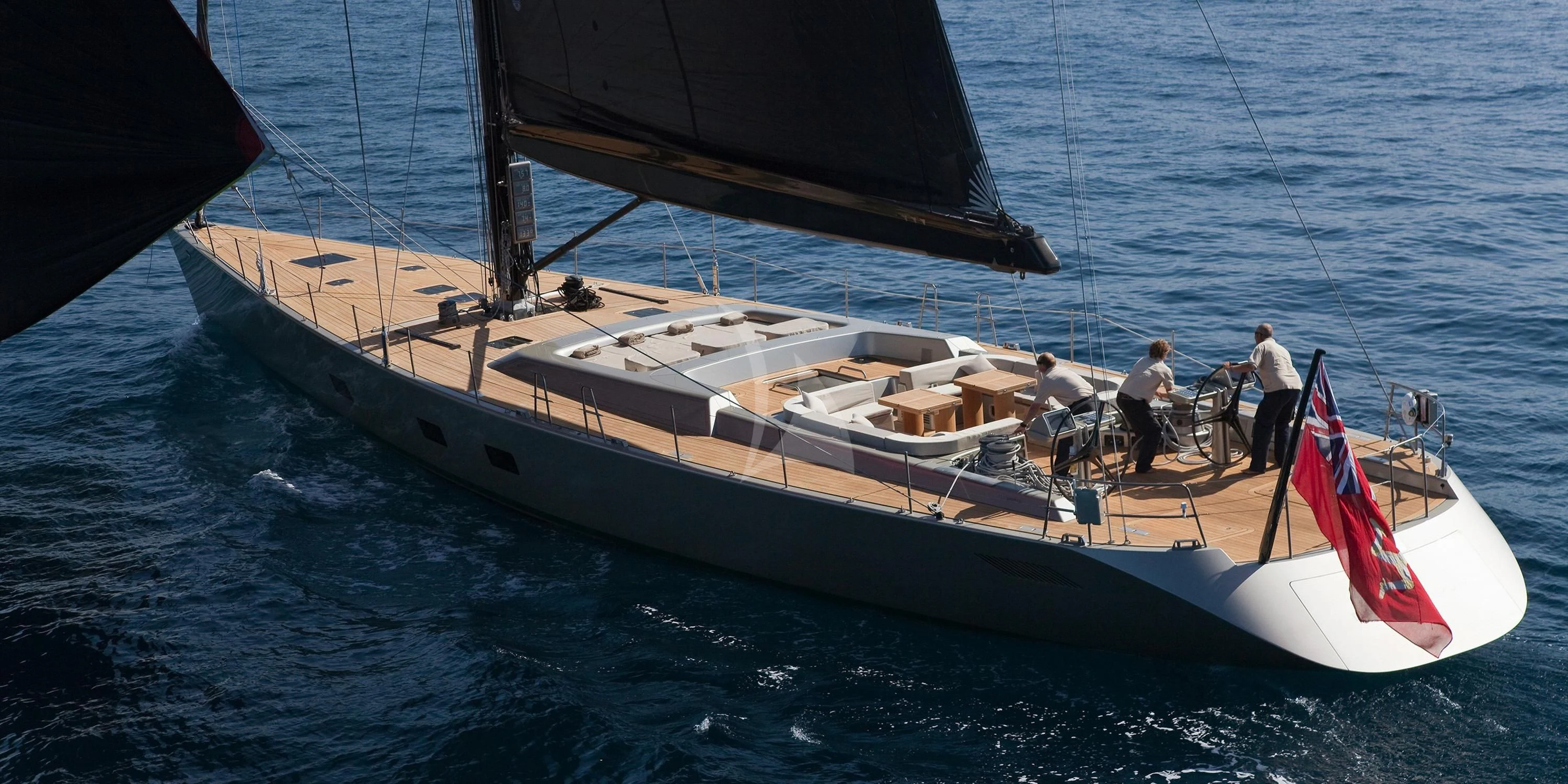 a boat with a group of people on it aboard RUNNING ON FAITH Yacht for Sale
