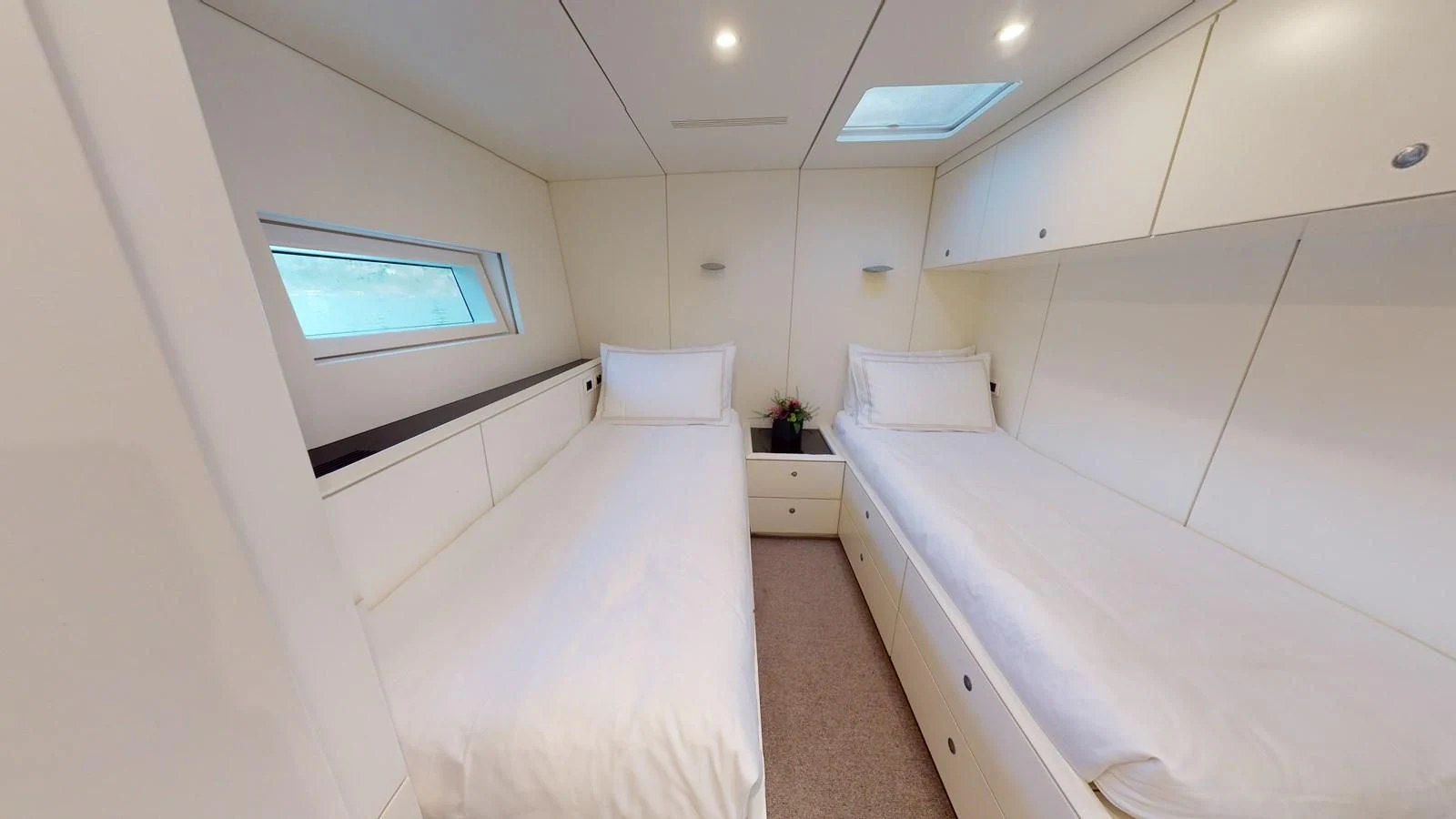 a room with two beds aboard RUNNING ON FAITH Yacht for Sale
