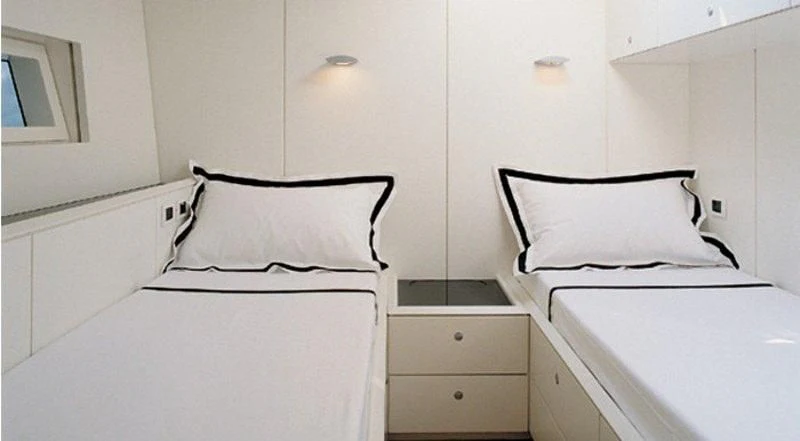 a couple of beds in a room aboard RUNNING ON FAITH Yacht for Sale