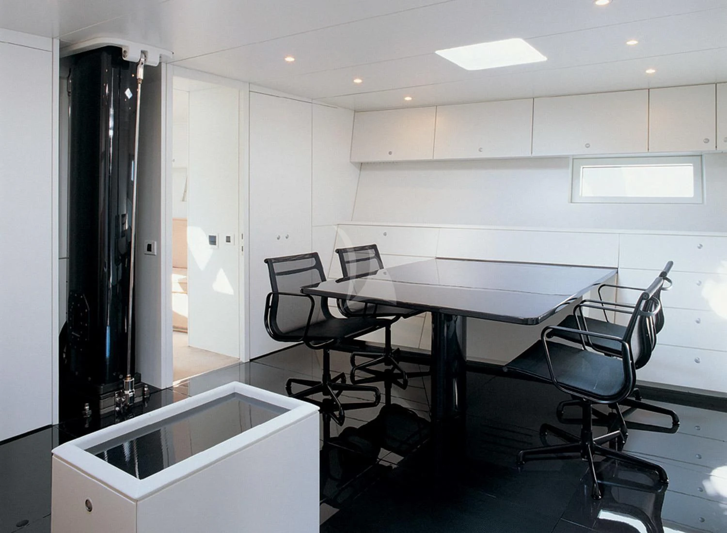 a room with a table and chairs aboard RUNNING ON FAITH Yacht for Sale