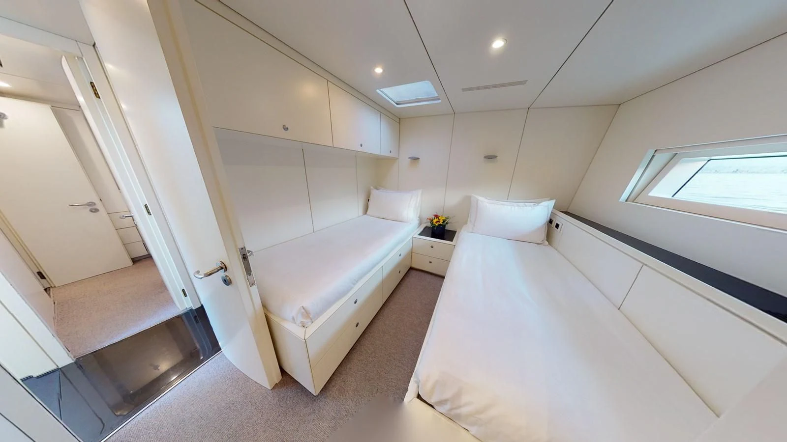 a room with two beds aboard RUNNING ON FAITH Yacht for Sale