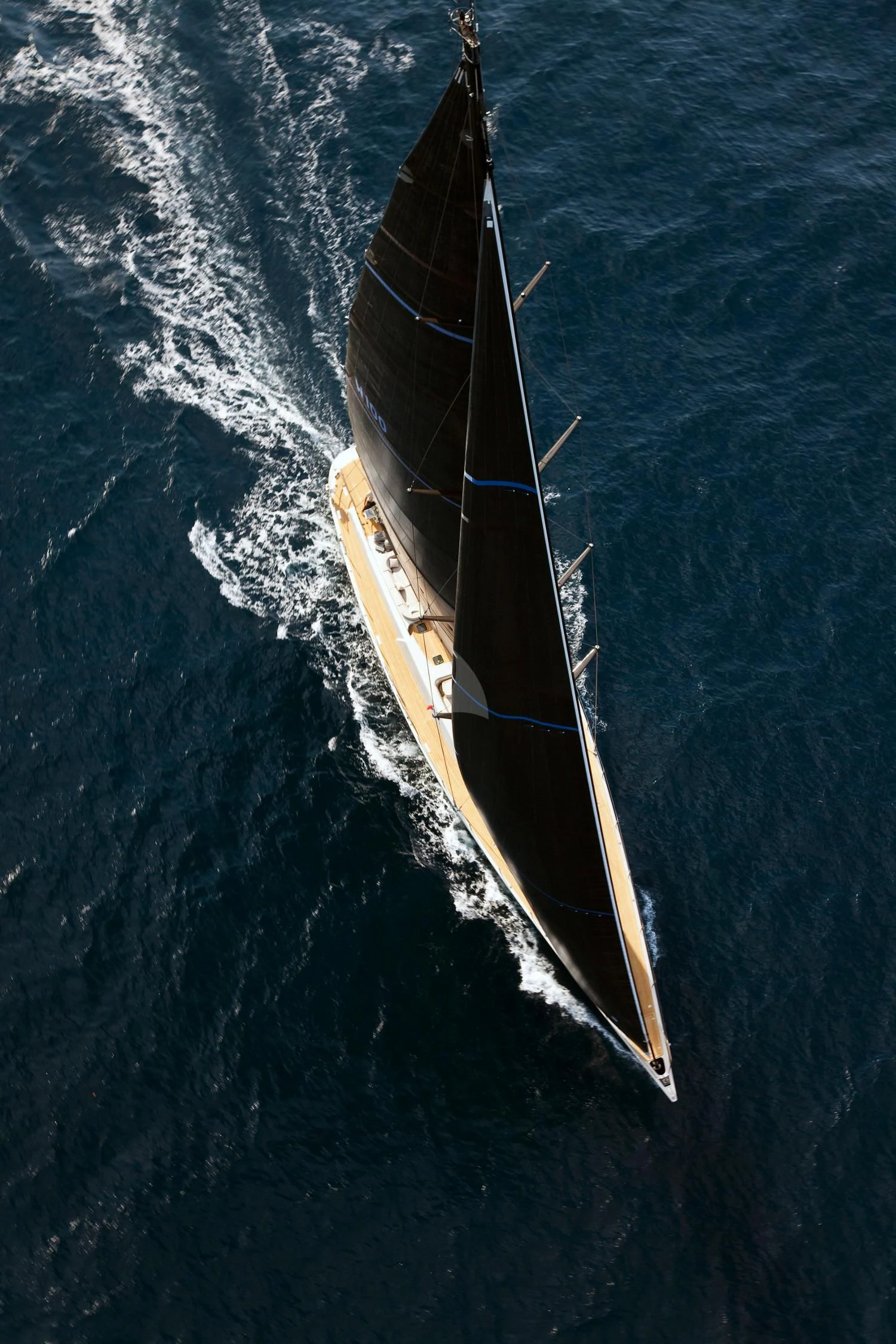 a long boat on the water aboard RUNNING ON FAITH Yacht for Sale