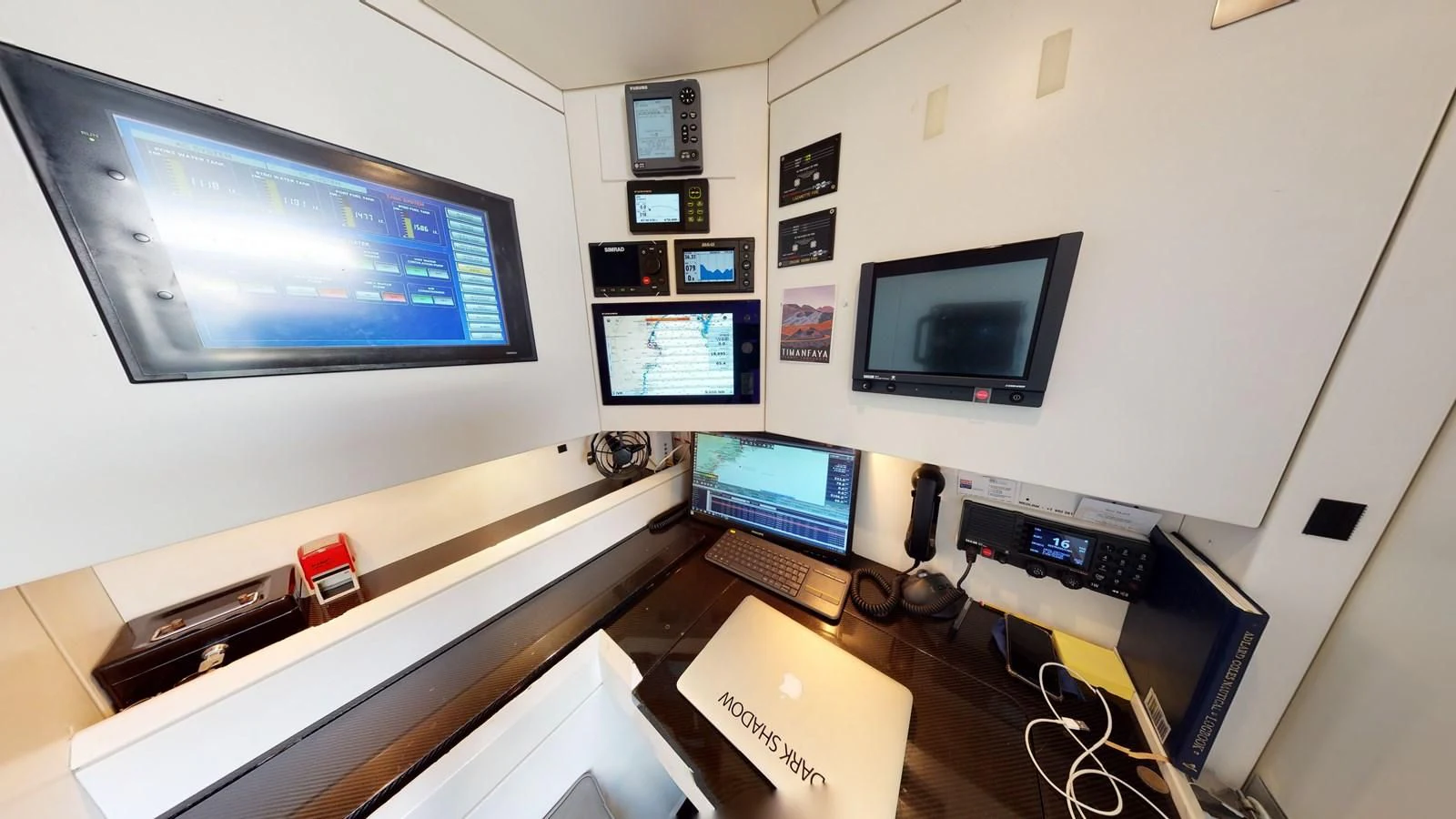 a desk with computers and monitors aboard RUNNING ON FAITH Yacht for Sale