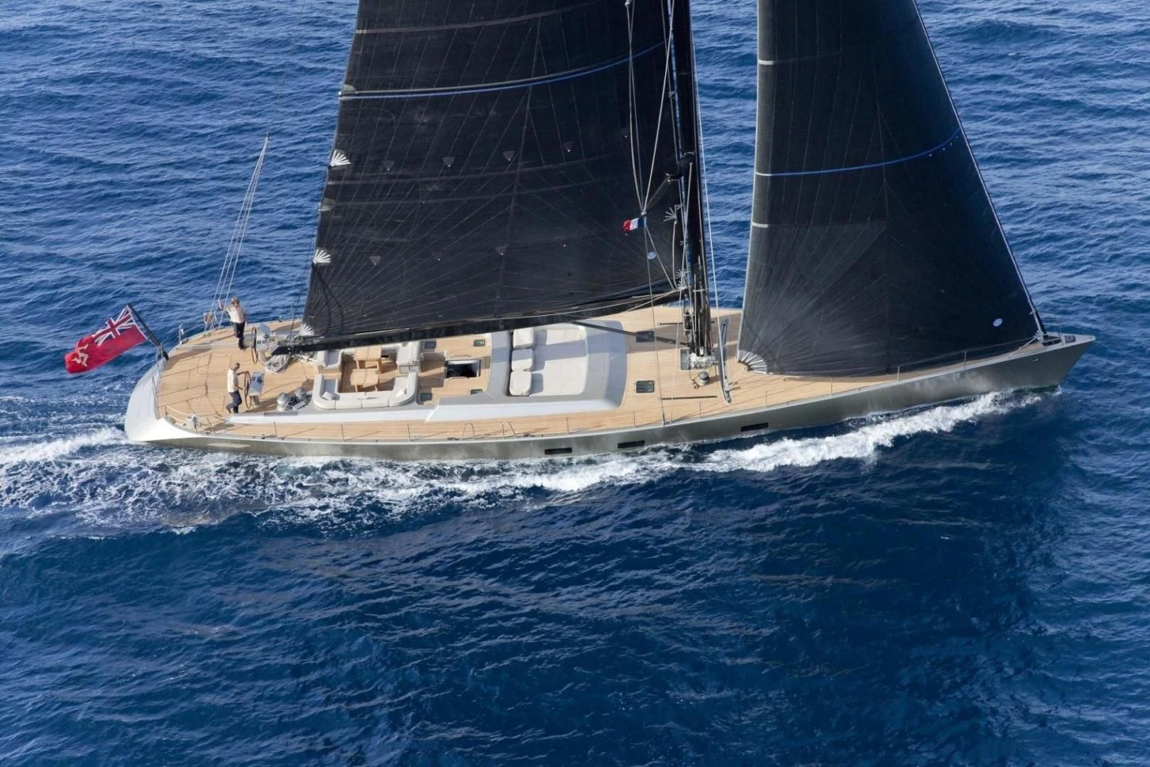 a boat sailing on the sea aboard RUNNING ON FAITH Yacht for Sale