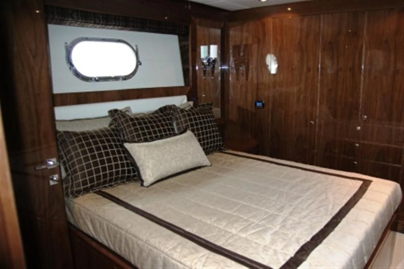 a bed with pillows aboard EBITDA Yacht for Sale