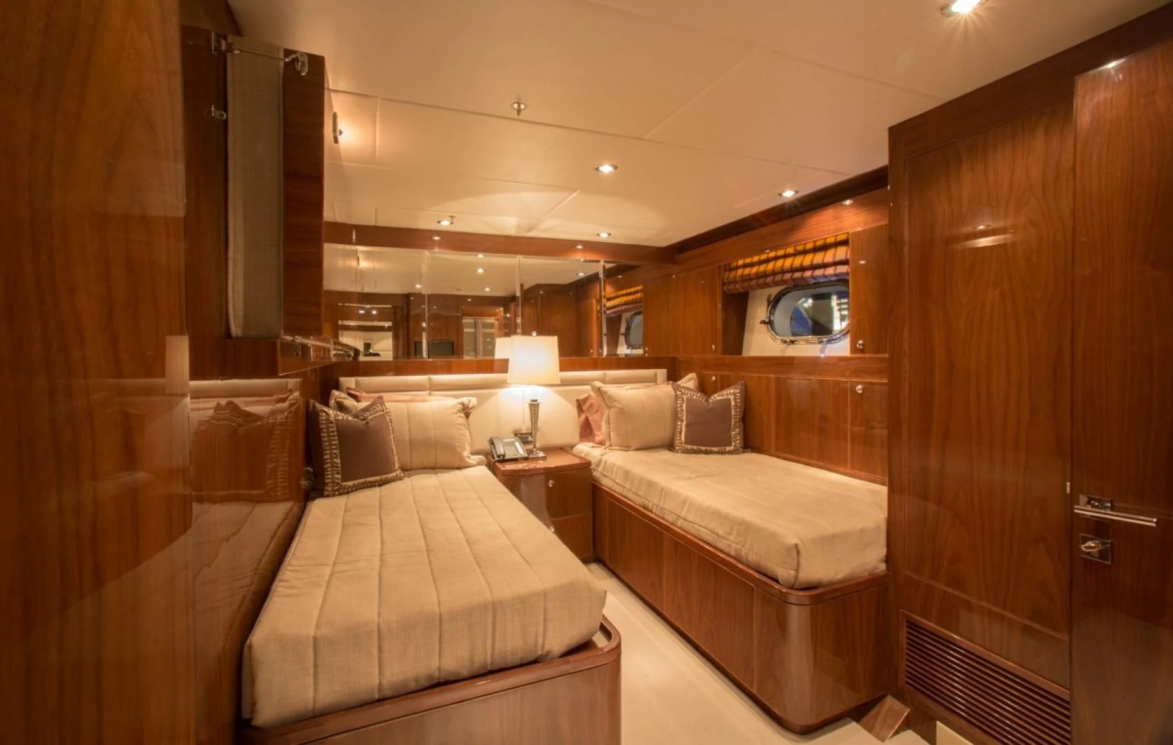 a room with two beds aboard EBITDA Yacht for Sale