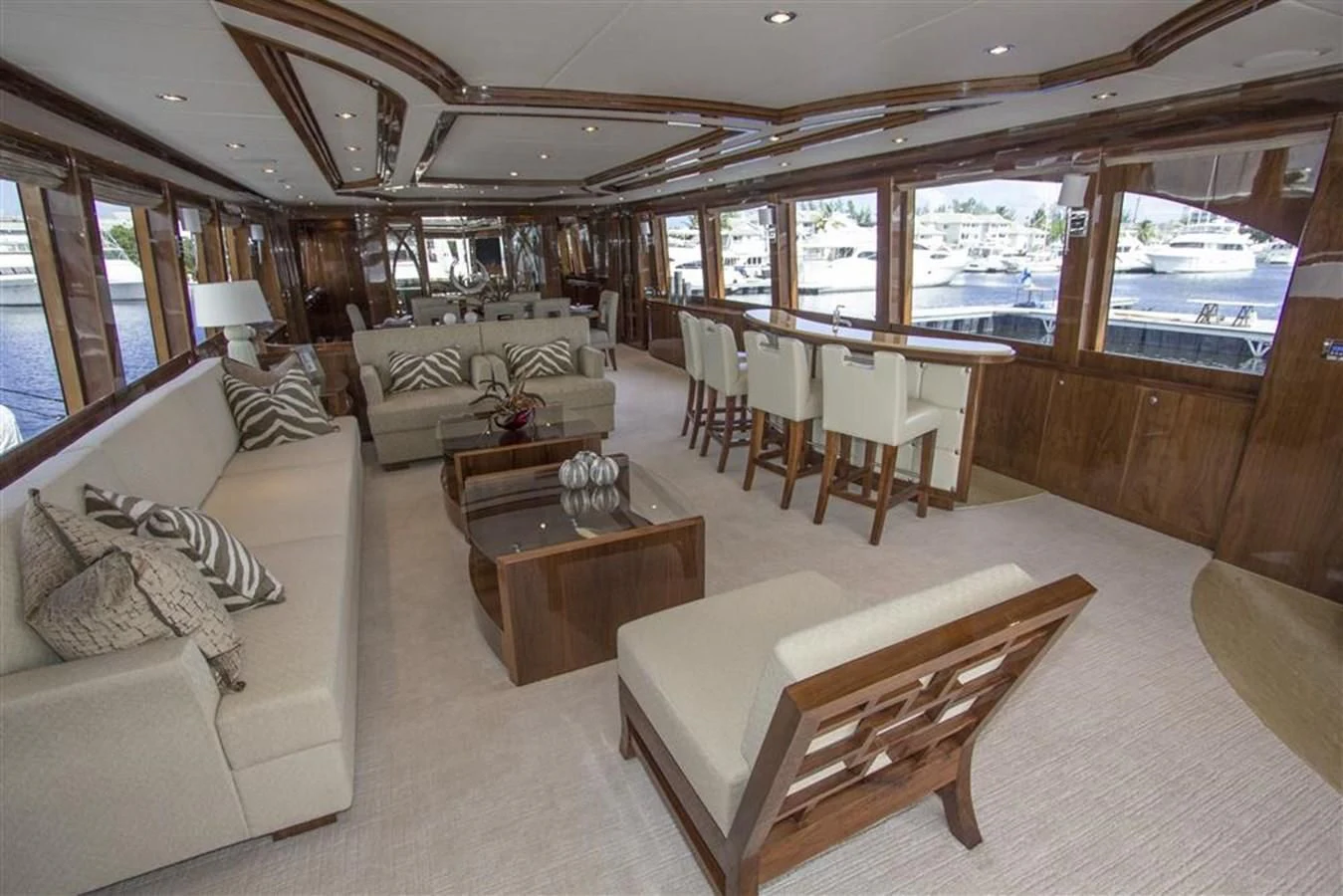 a living room with a large window aboard EBITDA Yacht for Sale
