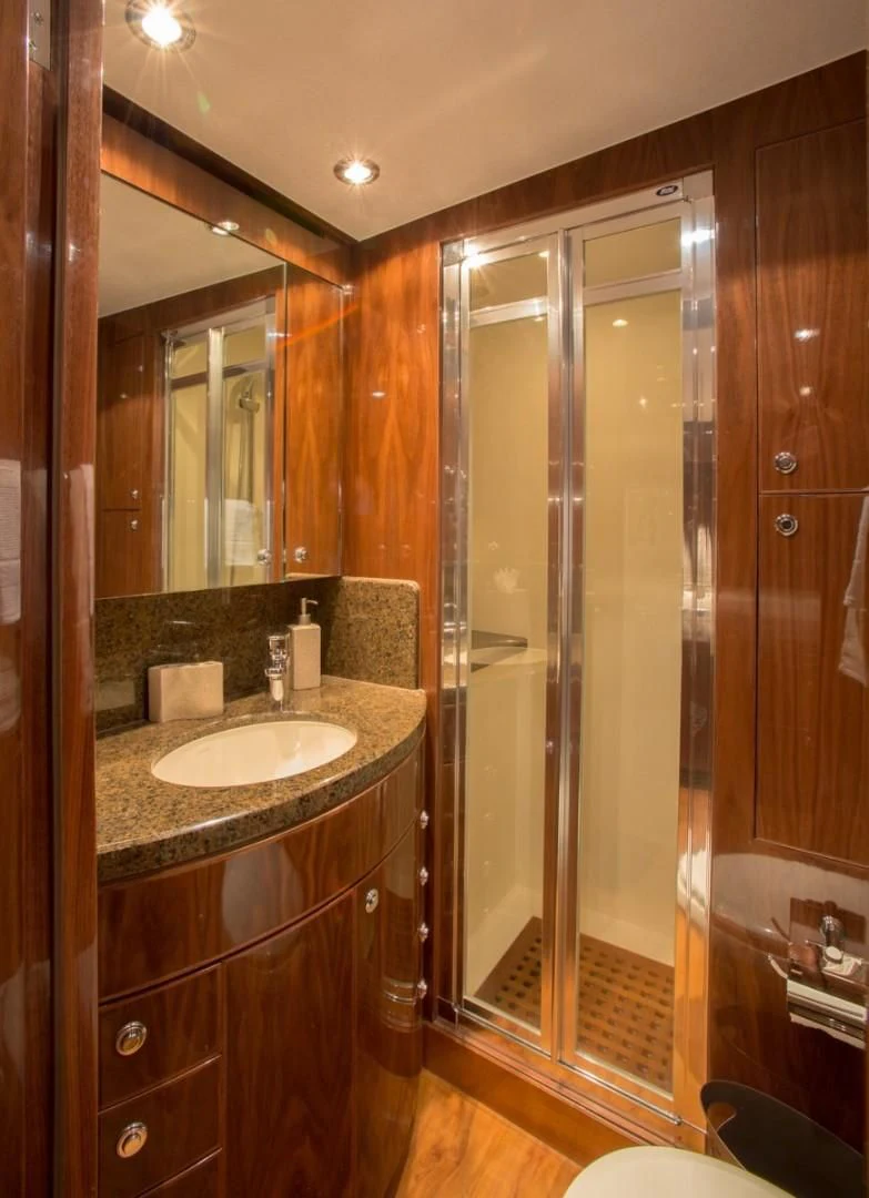 a bathroom with a large shower aboard EBITDA Yacht for Sale