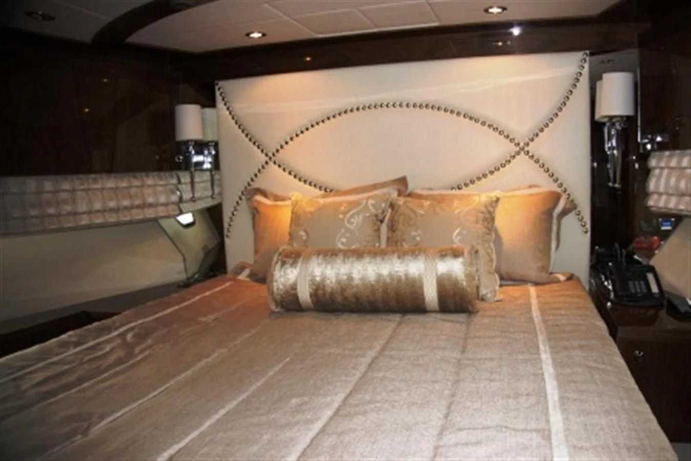 a bed with pillows aboard EBITDA Yacht for Sale