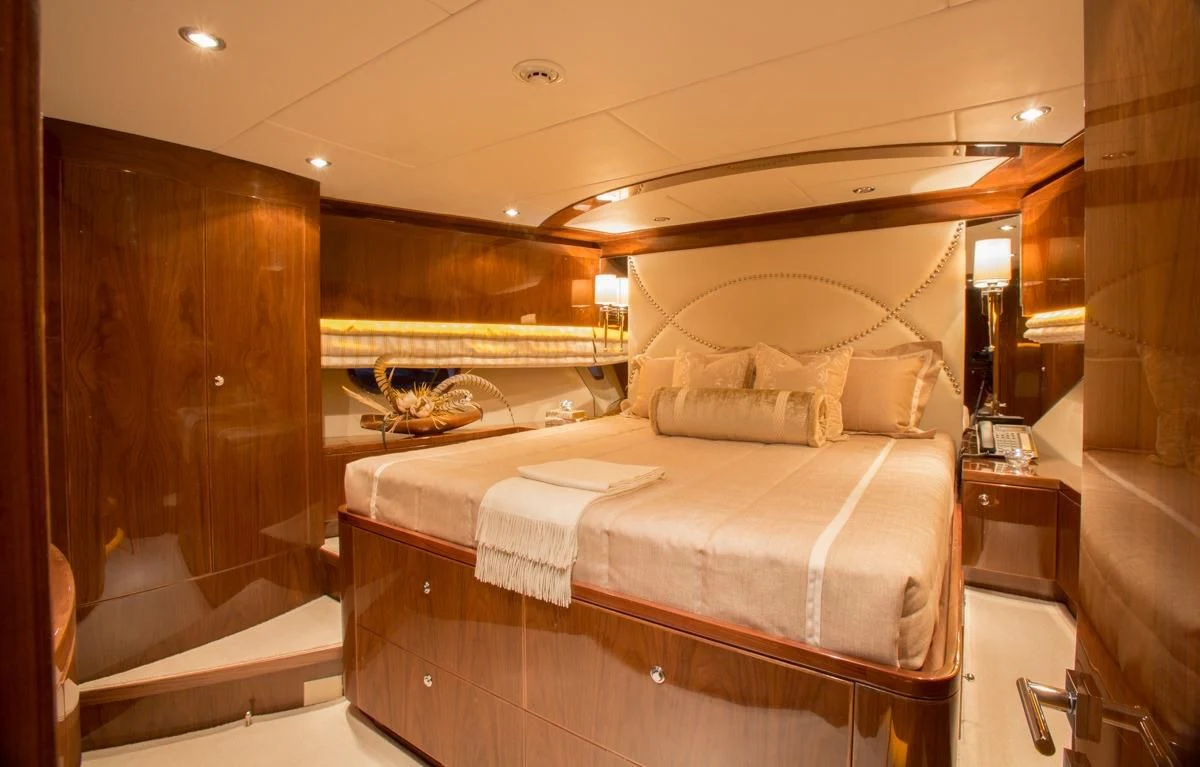 a bed in a room aboard EBITDA Yacht for Sale