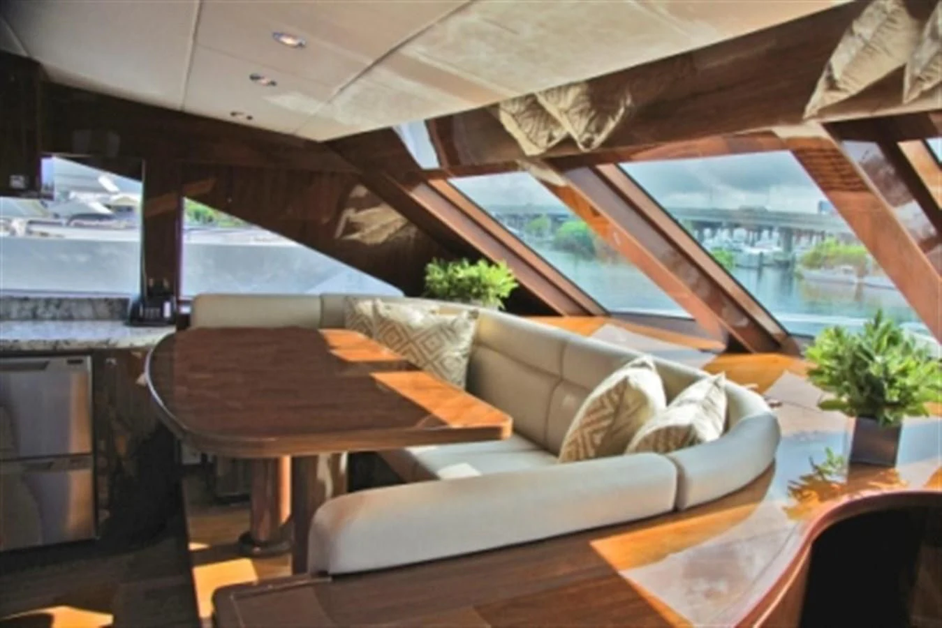 a room with a couch and a table aboard EBITDA Yacht for Sale