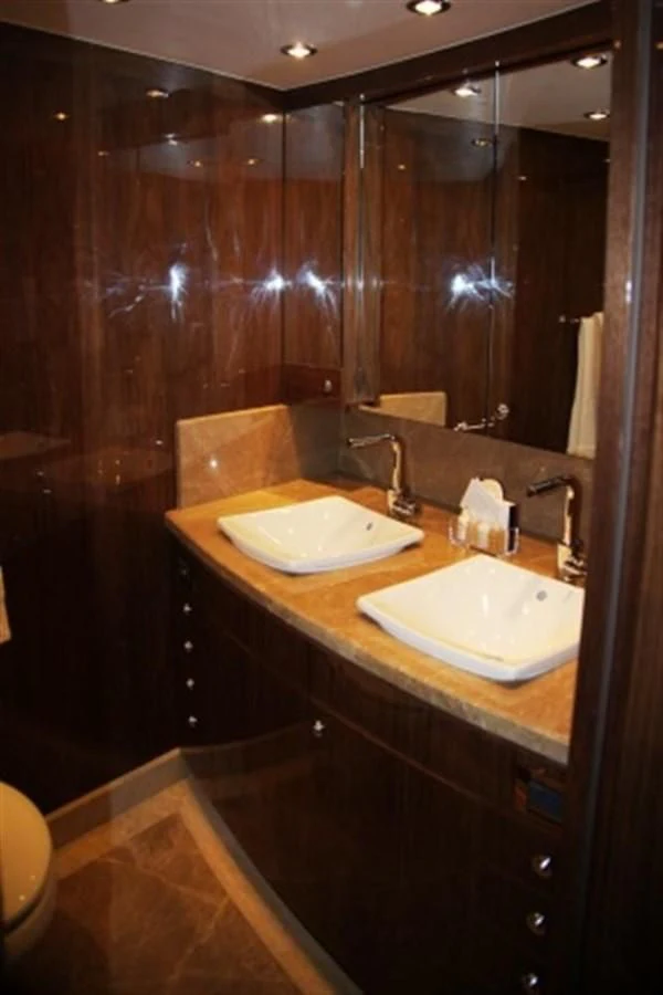 a bathroom with two sinks aboard EBITDA Yacht for Sale