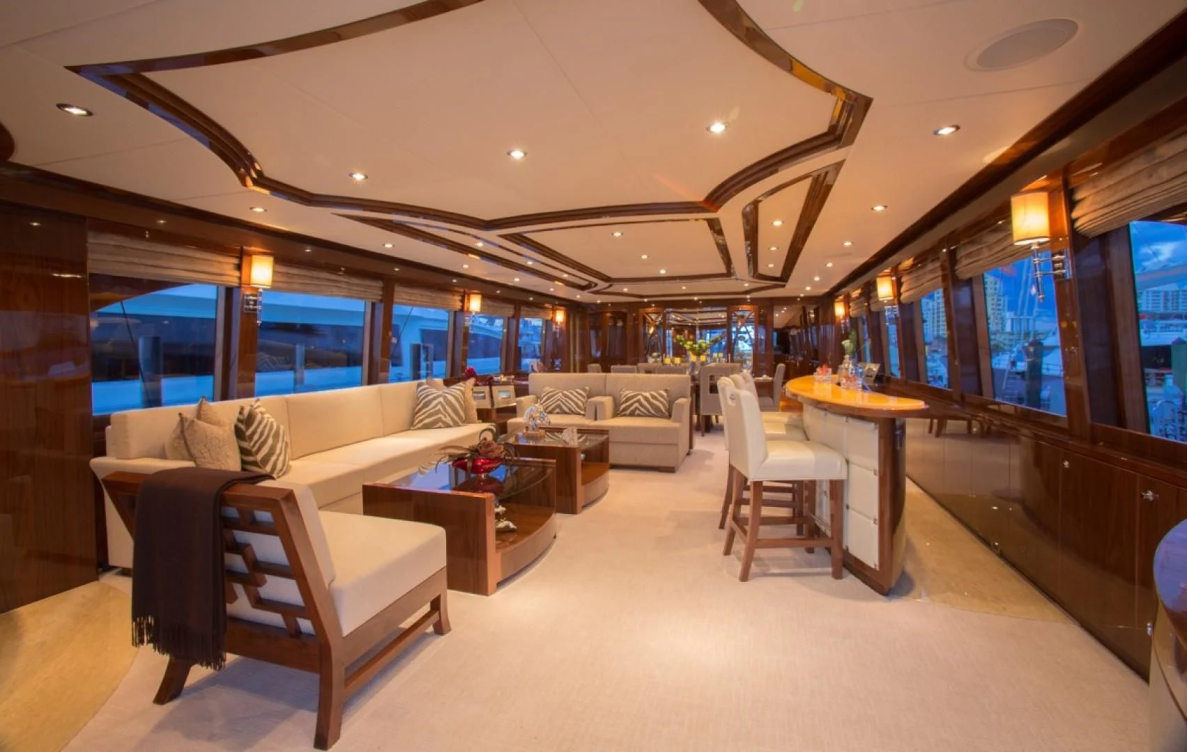 a room with couches and a table aboard EBITDA Yacht for Sale