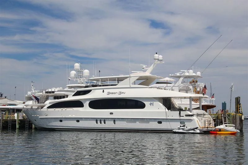 a large white yacht aboard EBITDA Yacht for Sale
