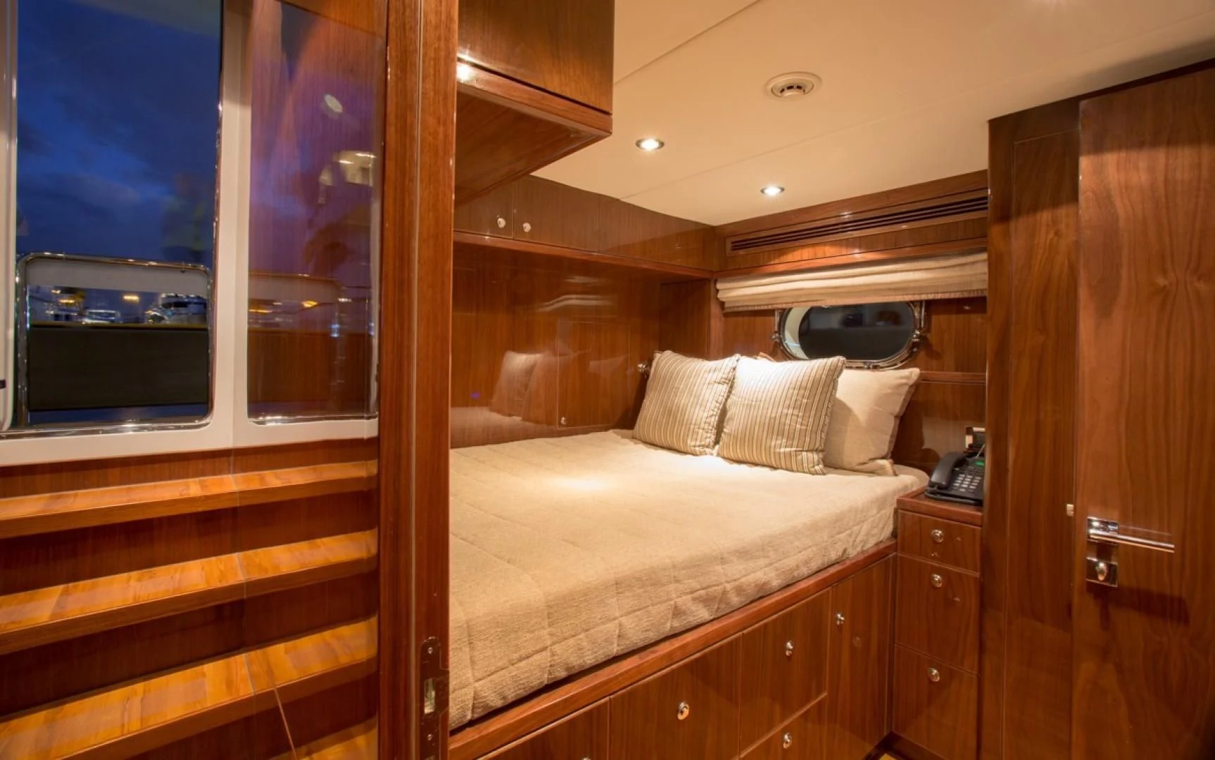 a bed in a room aboard EBITDA Yacht for Sale