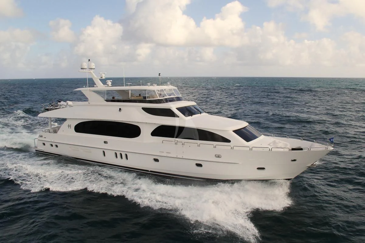 a white yacht on the water aboard EBITDA Yacht for Sale