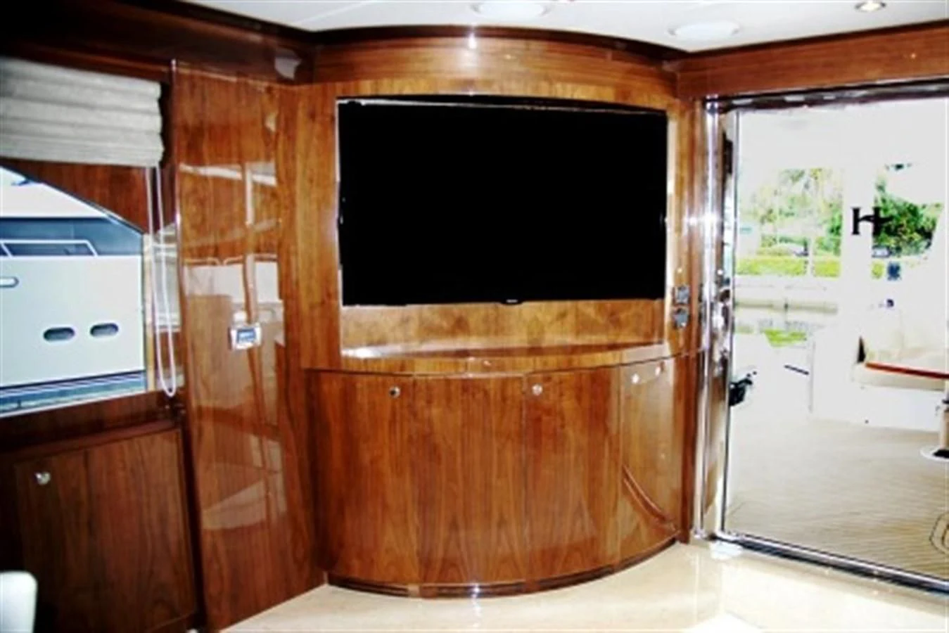 a wooden cabinet in a room aboard EBITDA Yacht for Sale