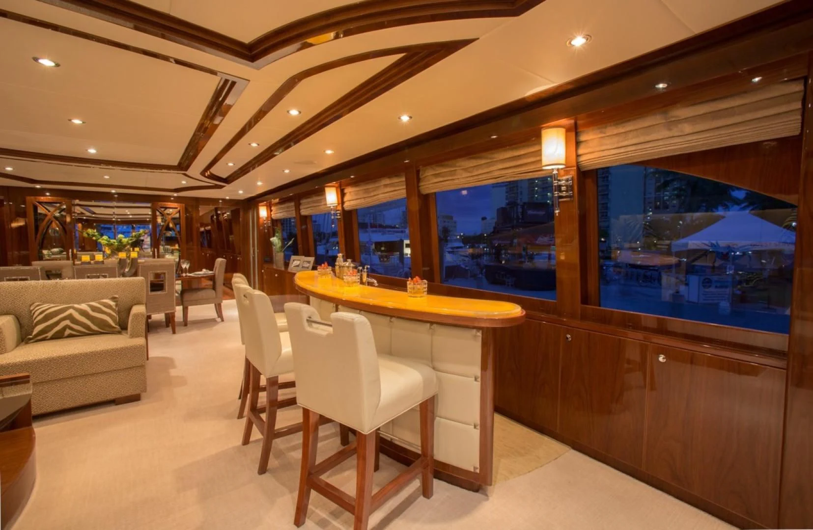 a room with a table and chairs aboard EBITDA Yacht for Sale