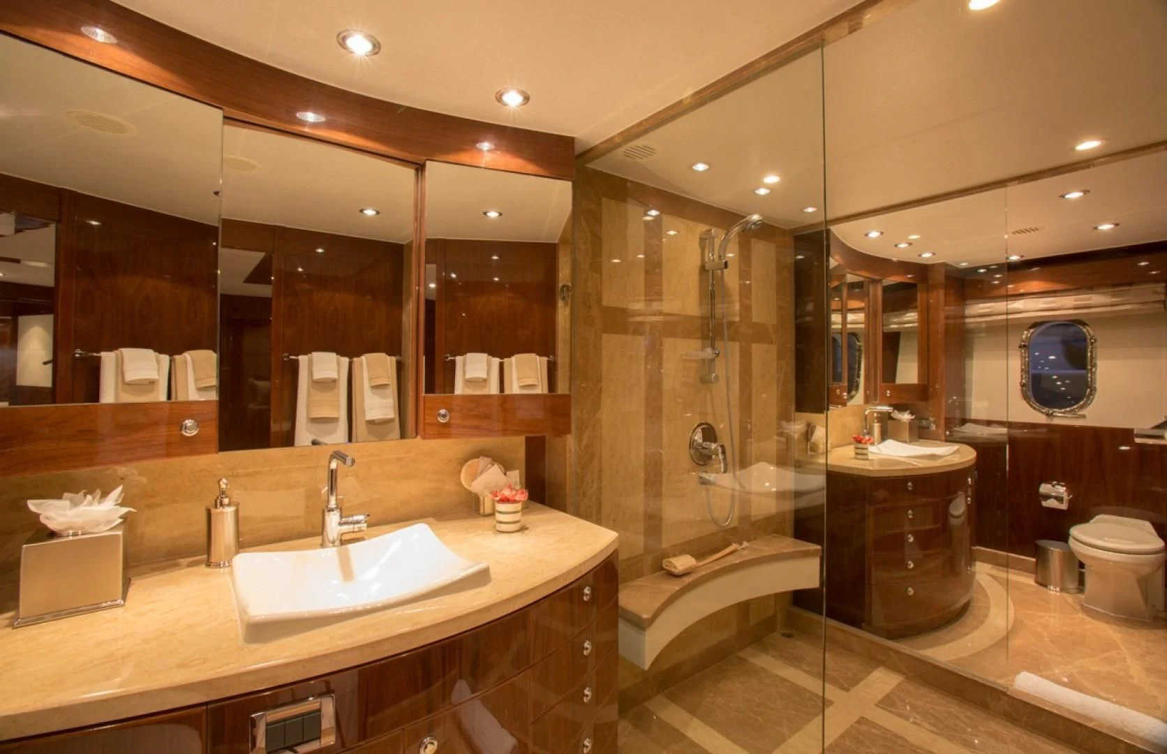 a bathroom with a large mirror aboard EBITDA Yacht for Sale