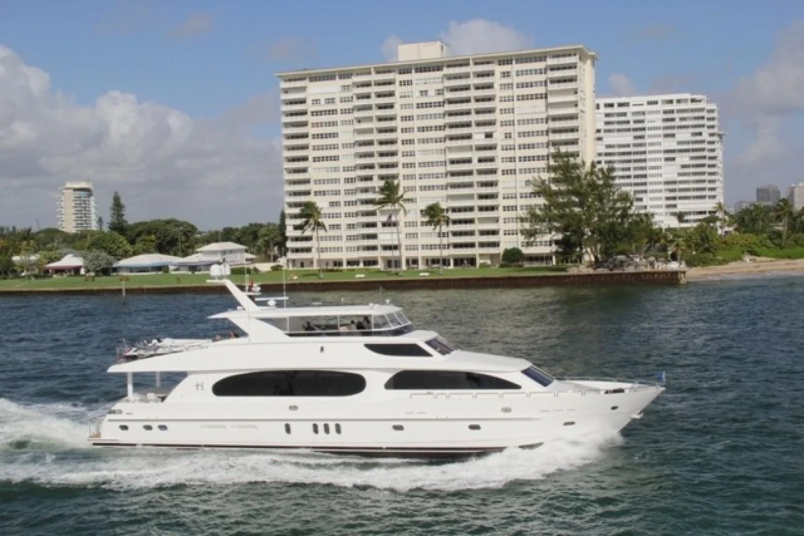 a white yacht in the water aboard EBITDA Yacht for Sale