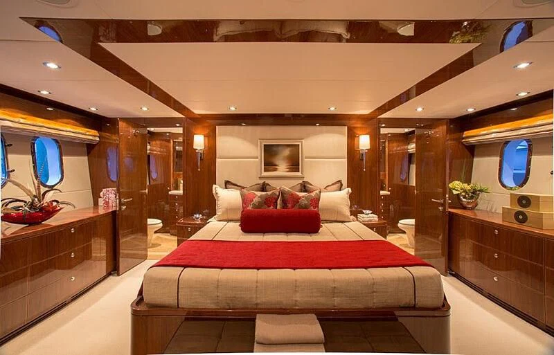 a bed in a room aboard EBITDA Yacht for Sale