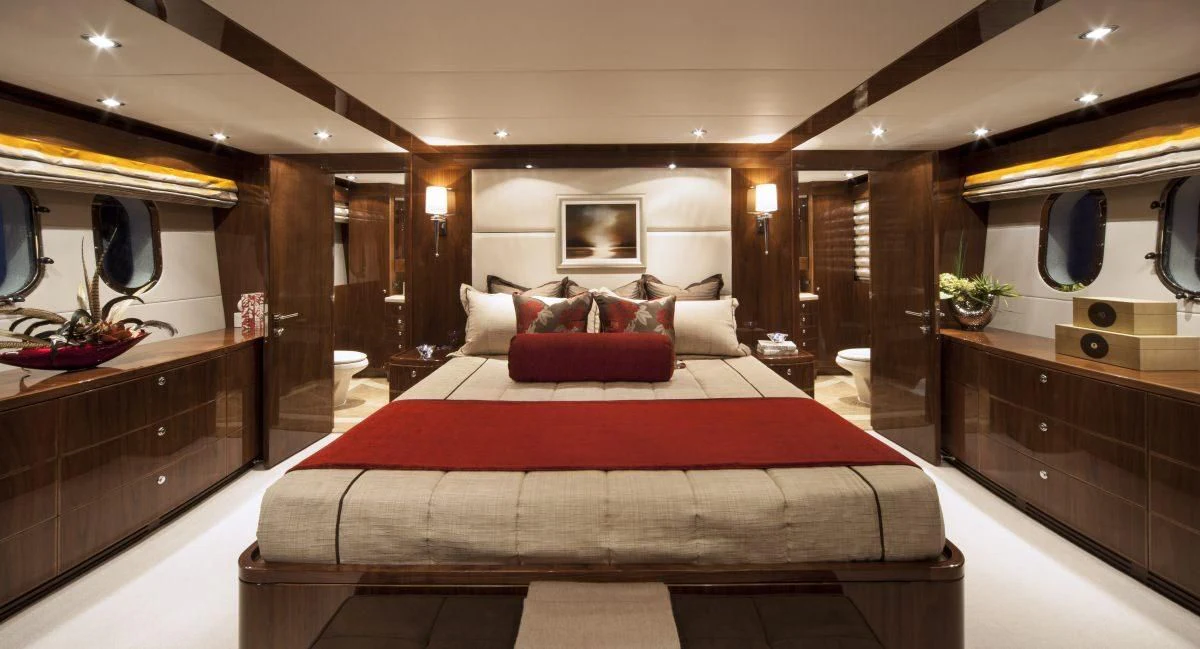 a large bed in a room aboard EBITDA Yacht for Sale