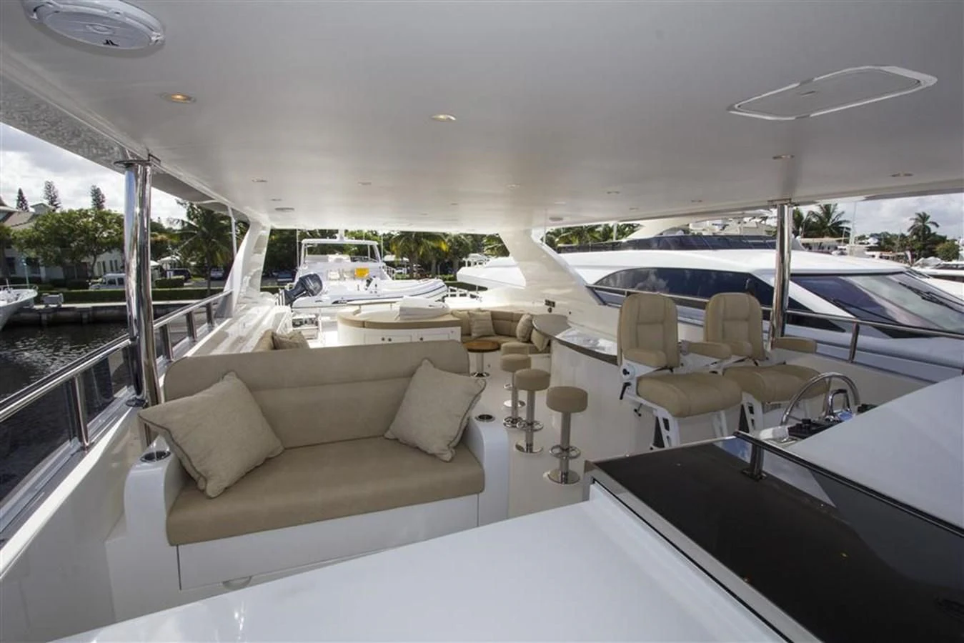 a room with a couch and a table and chairs aboard EBITDA Yacht for Sale