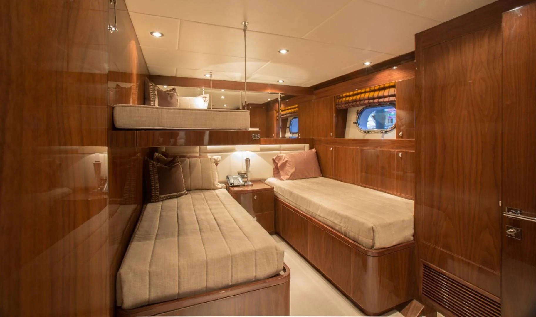 a room with a bed and a desk aboard EBITDA Yacht for Sale