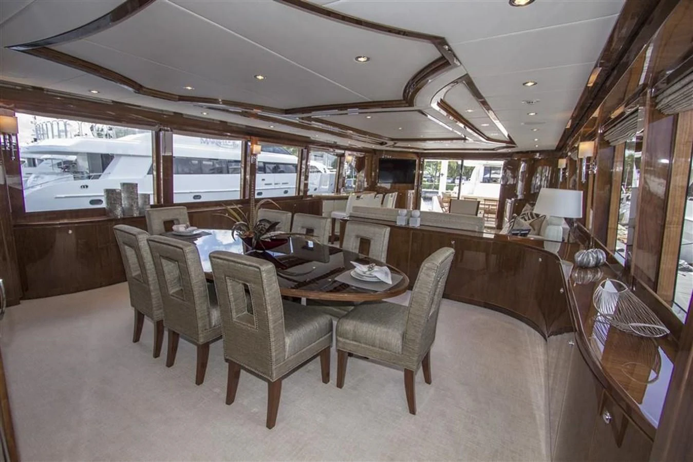 a dining room with a table and chairs aboard EBITDA Yacht for Sale
