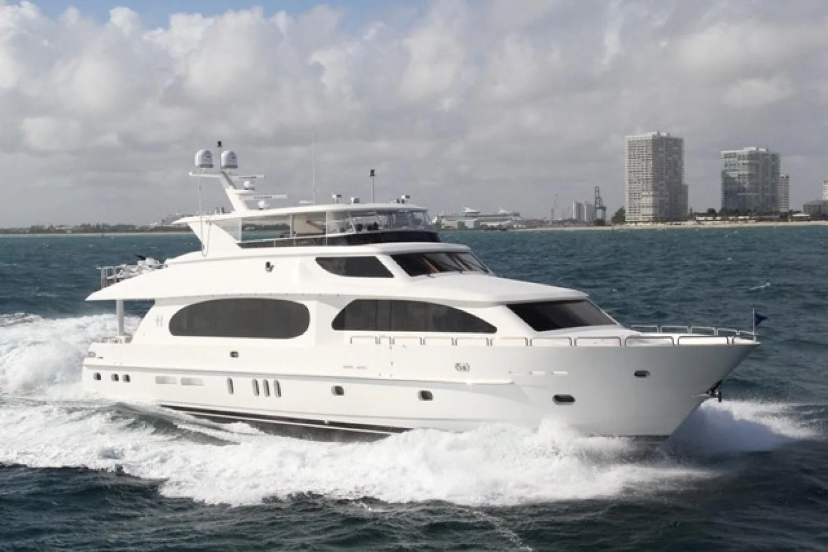 a white yacht in the water aboard EBITDA Yacht for Sale