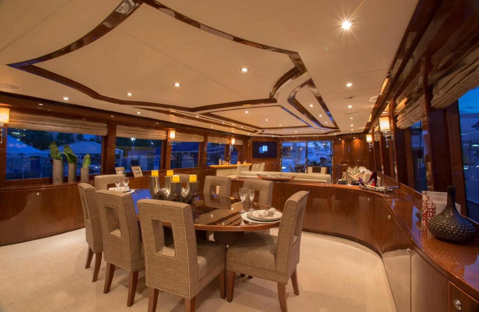 a room with a table and chairs aboard EBITDA Yacht for Sale
