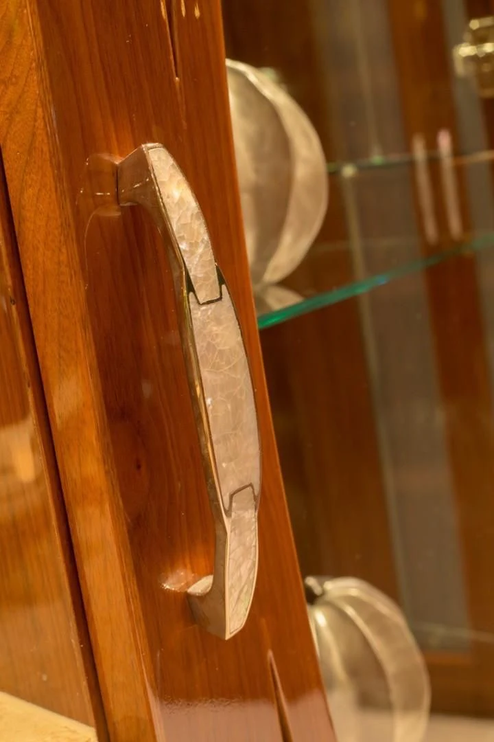 a wooden object with a handle aboard EBITDA Yacht for Sale