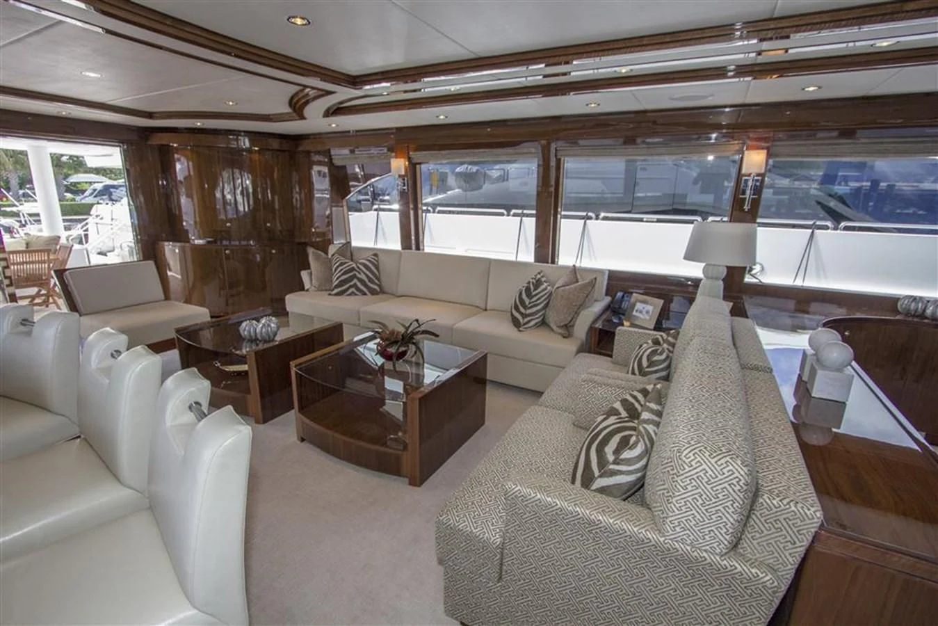 a living room with a couch and a coffee table aboard EBITDA Yacht for Sale