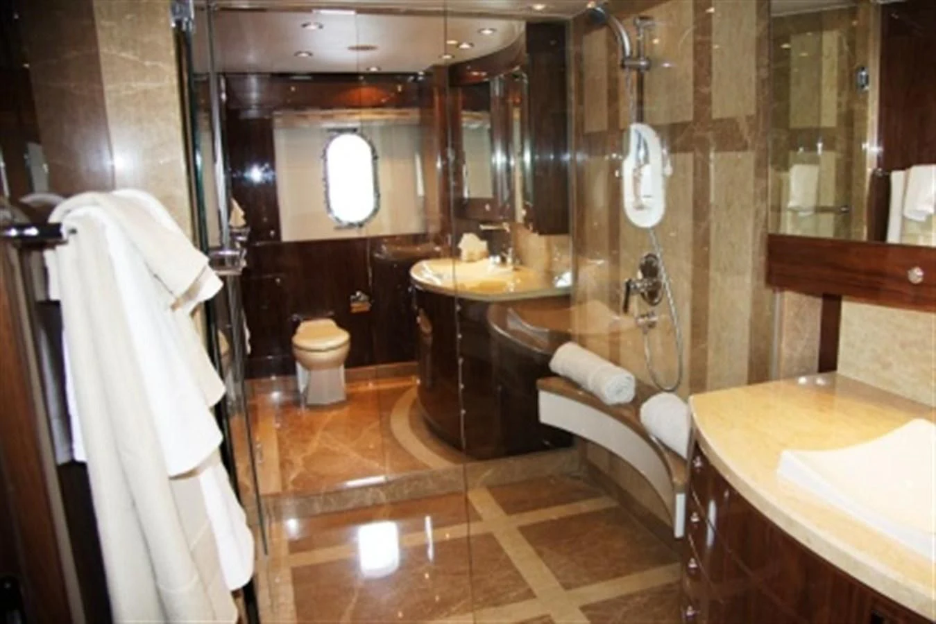 a bathroom with a sink and a mirror aboard EBITDA Yacht for Sale