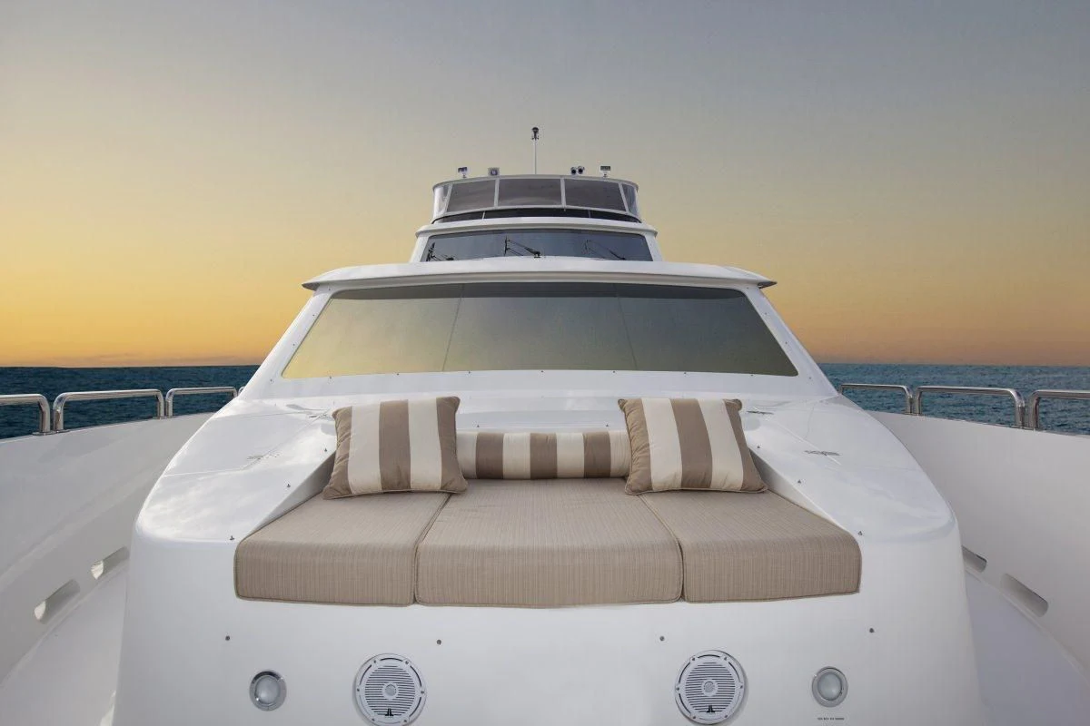 a white car with a white roof aboard EBITDA Yacht for Sale