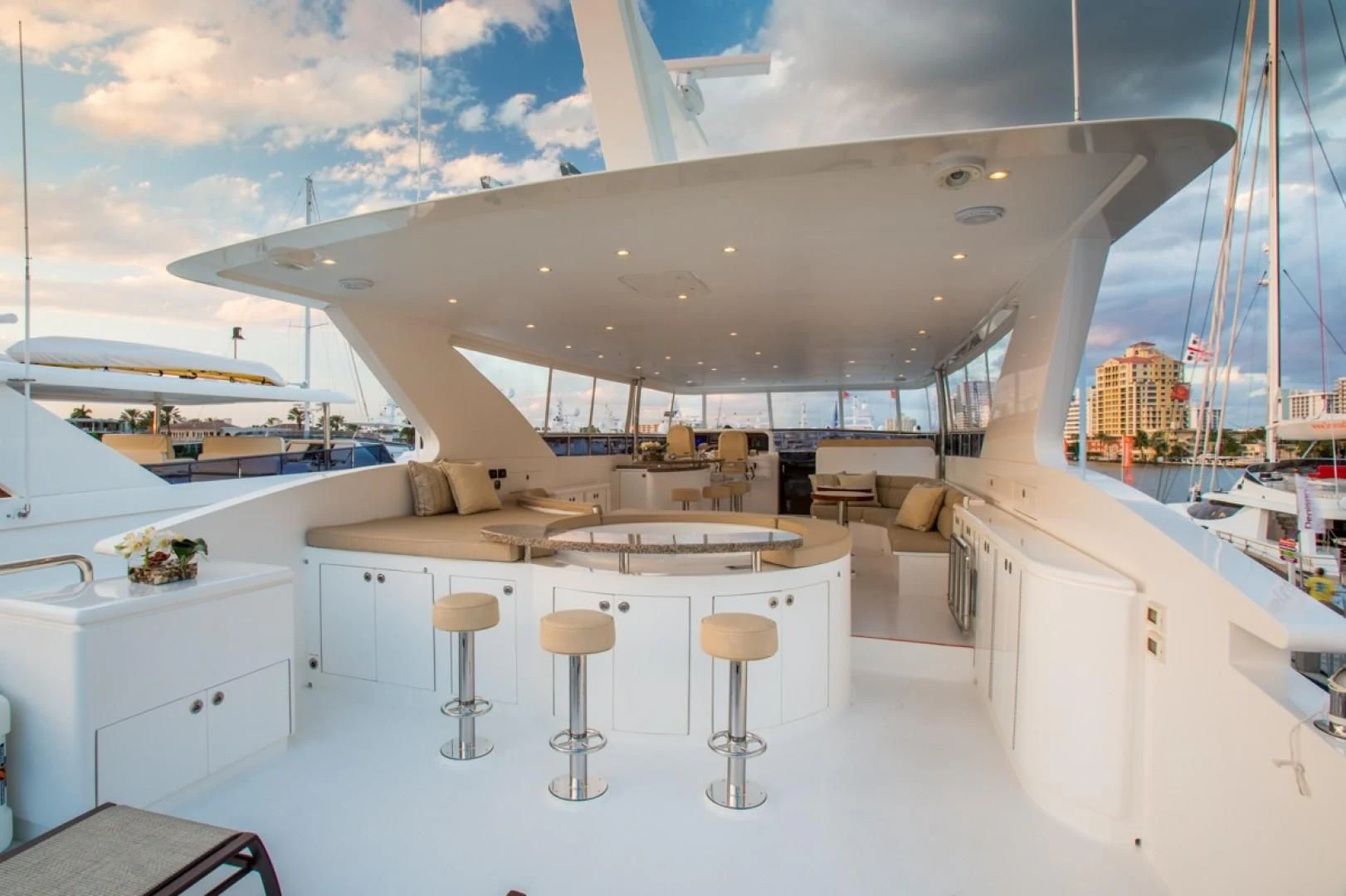 a room with a view of the city and the ocean aboard EBITDA Yacht for Sale