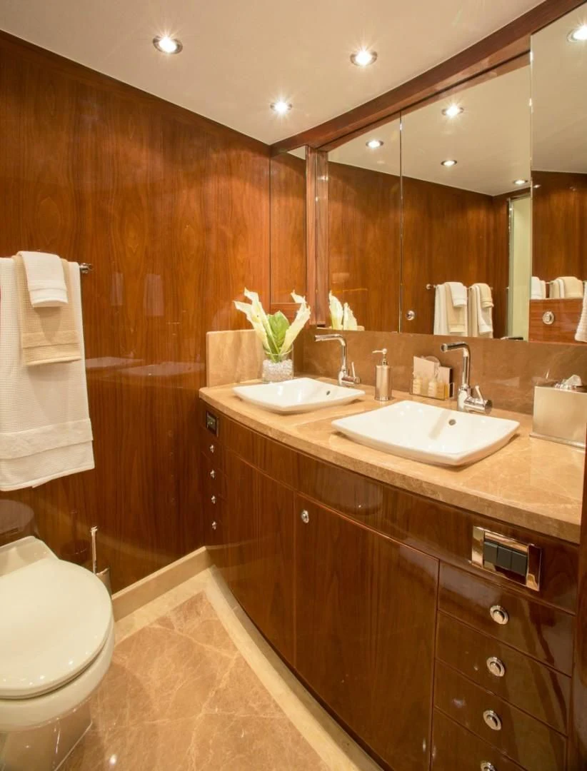 a bathroom with a sink and a toilet aboard EBITDA Yacht for Sale