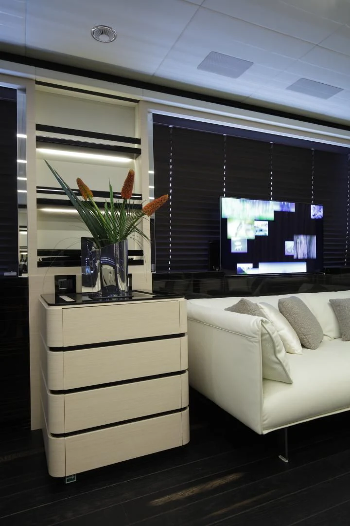a room with a tv and a couch aboard NOVASTAR Yacht for Sale