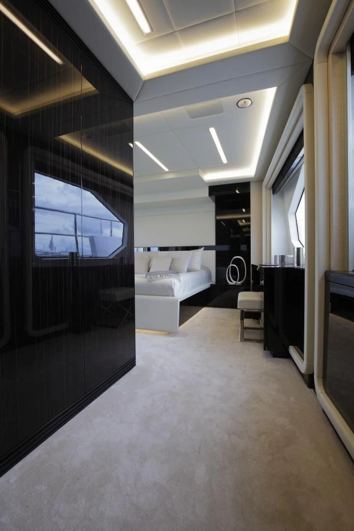 a room with a bed and a window aboard NOVASTAR Yacht for Sale